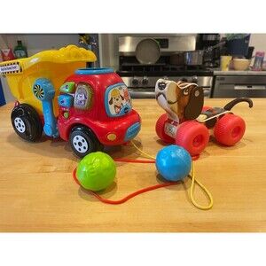 Fisher-Price Little snoopy and VTech Drop and Go Dump Truck Toy bundle